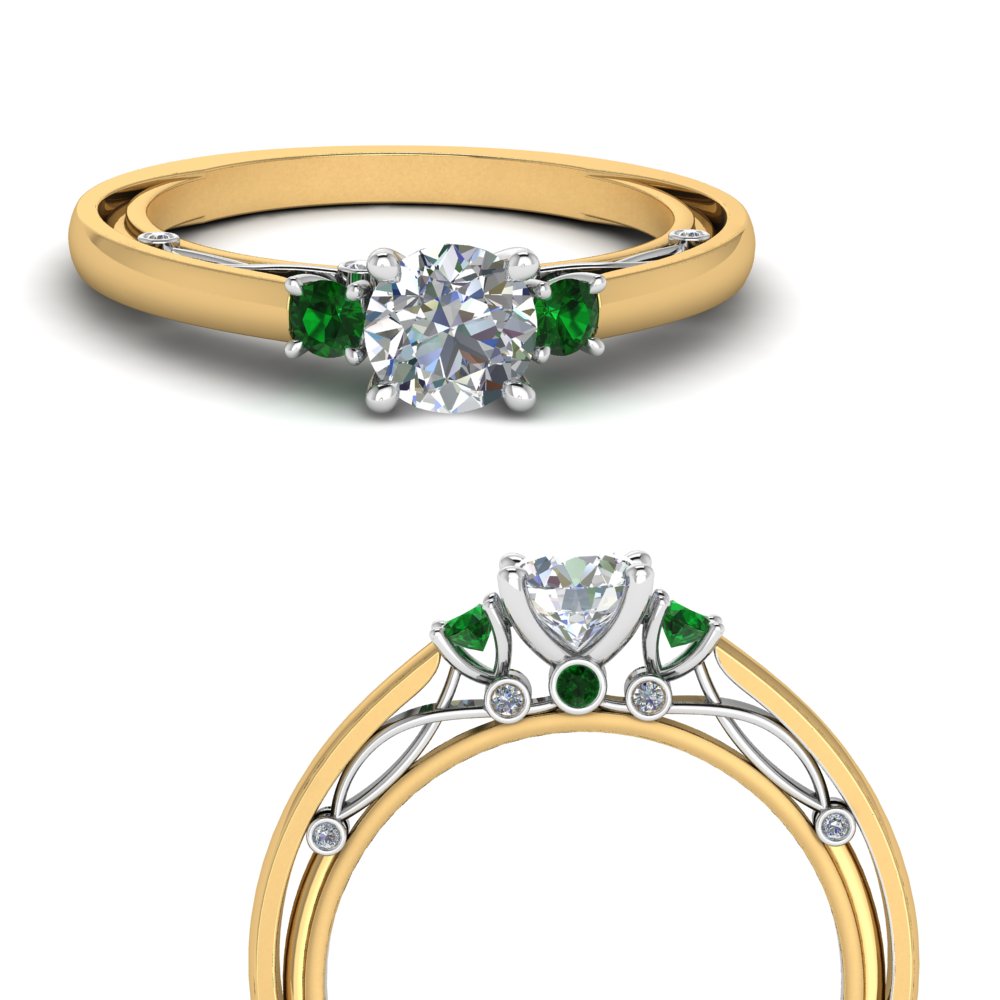 diamond ring with two emeralds