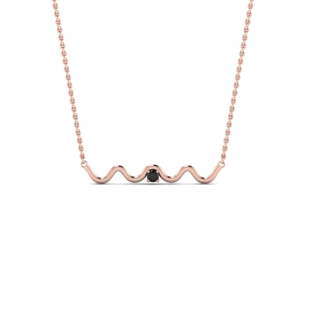 gold pendant with black stone
